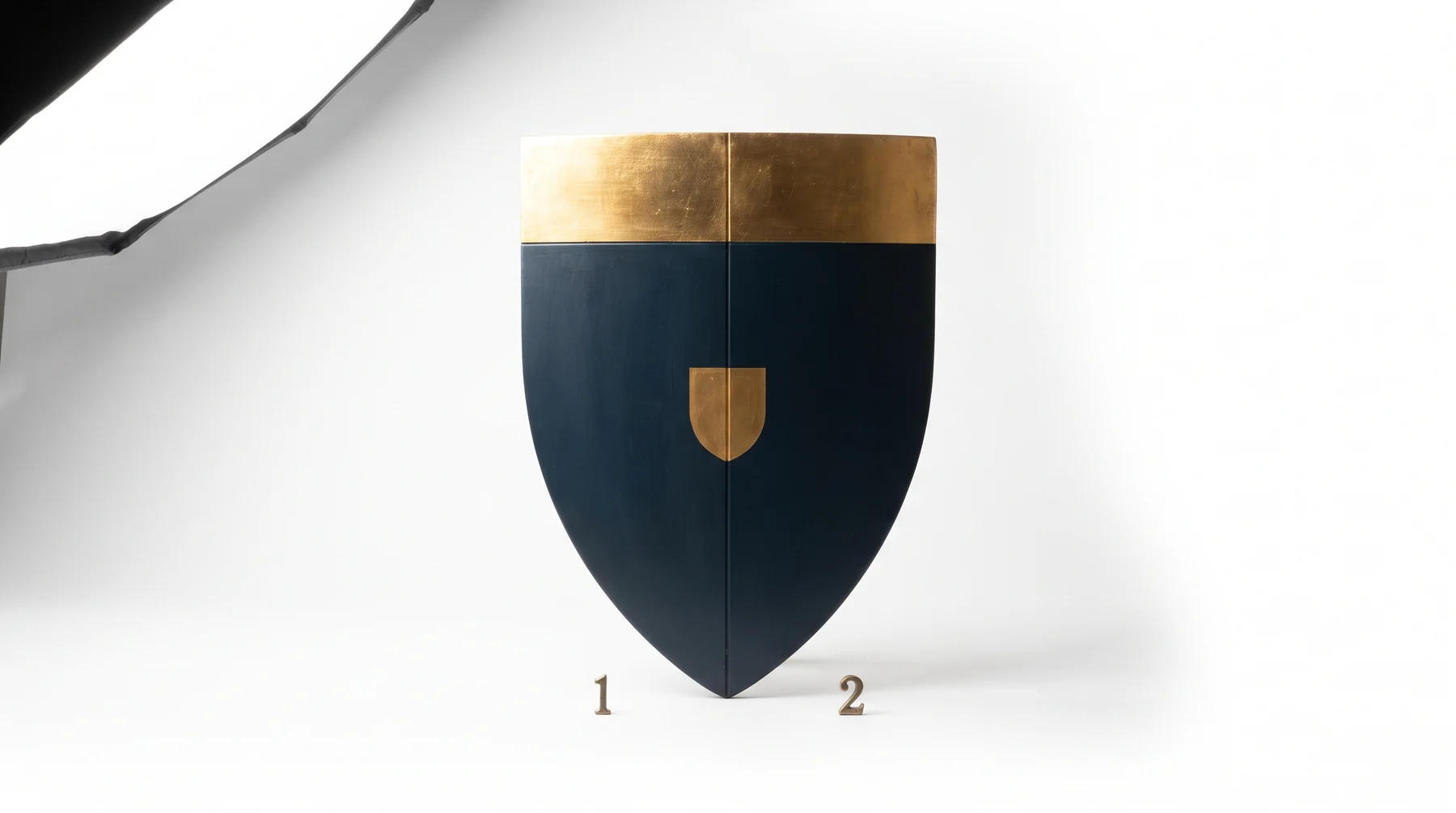 The back of a shield seen over the shoulder of the person carrying it, with their forearm through the leather straps and the two sides marked one and two