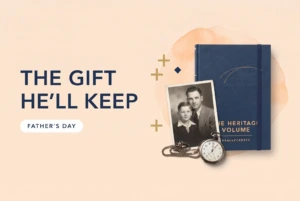 The Heritage Volume with a navy ribbon, a 1940s father and son portrait and a pocket watch, with a card reading For Dad
